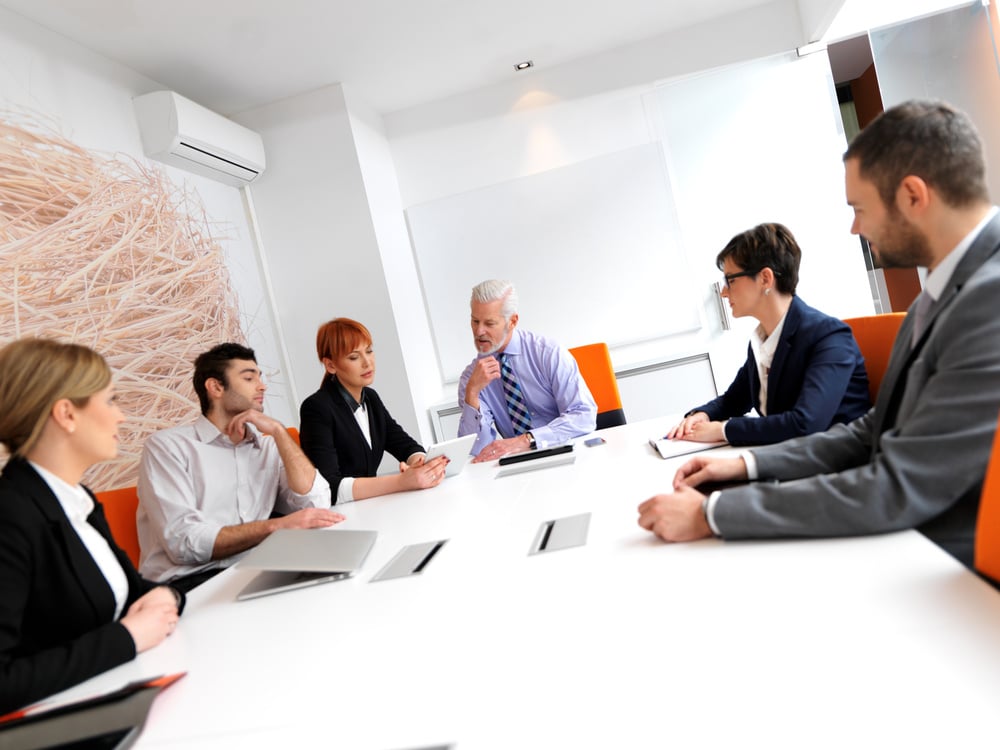 business people group on meeting at modern bright office indoors. Senior businessman as leader in discussion. business people group on meeting at modern bright office indoors. Senior businessman as leader in discussion.